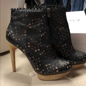 BCBG Maxazria black boots with cut out detail